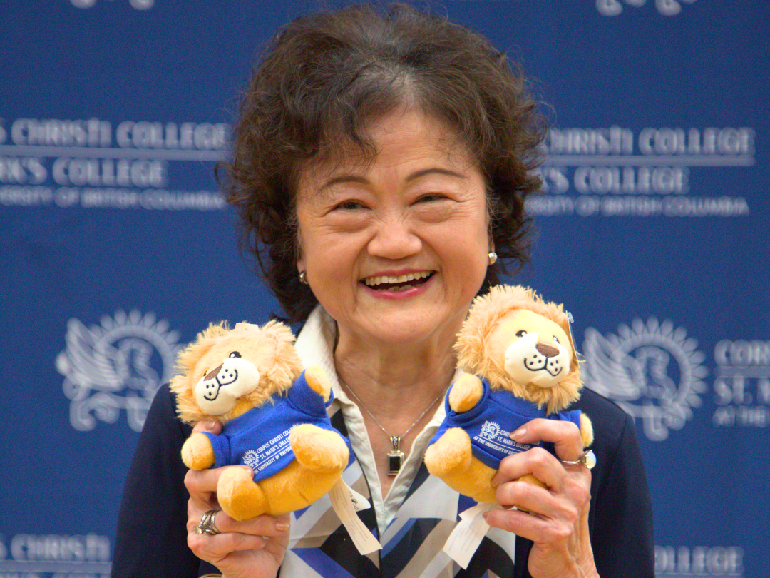 Jenny Cheng—whose gift funded the creation of the full-size mascot costume, supported a student honorarium for Marko’s appearances at events, and helped produce Marko stuffies—holds up two miniature versions of the new mascot at the 25th Annual Fundraising Breakfast.